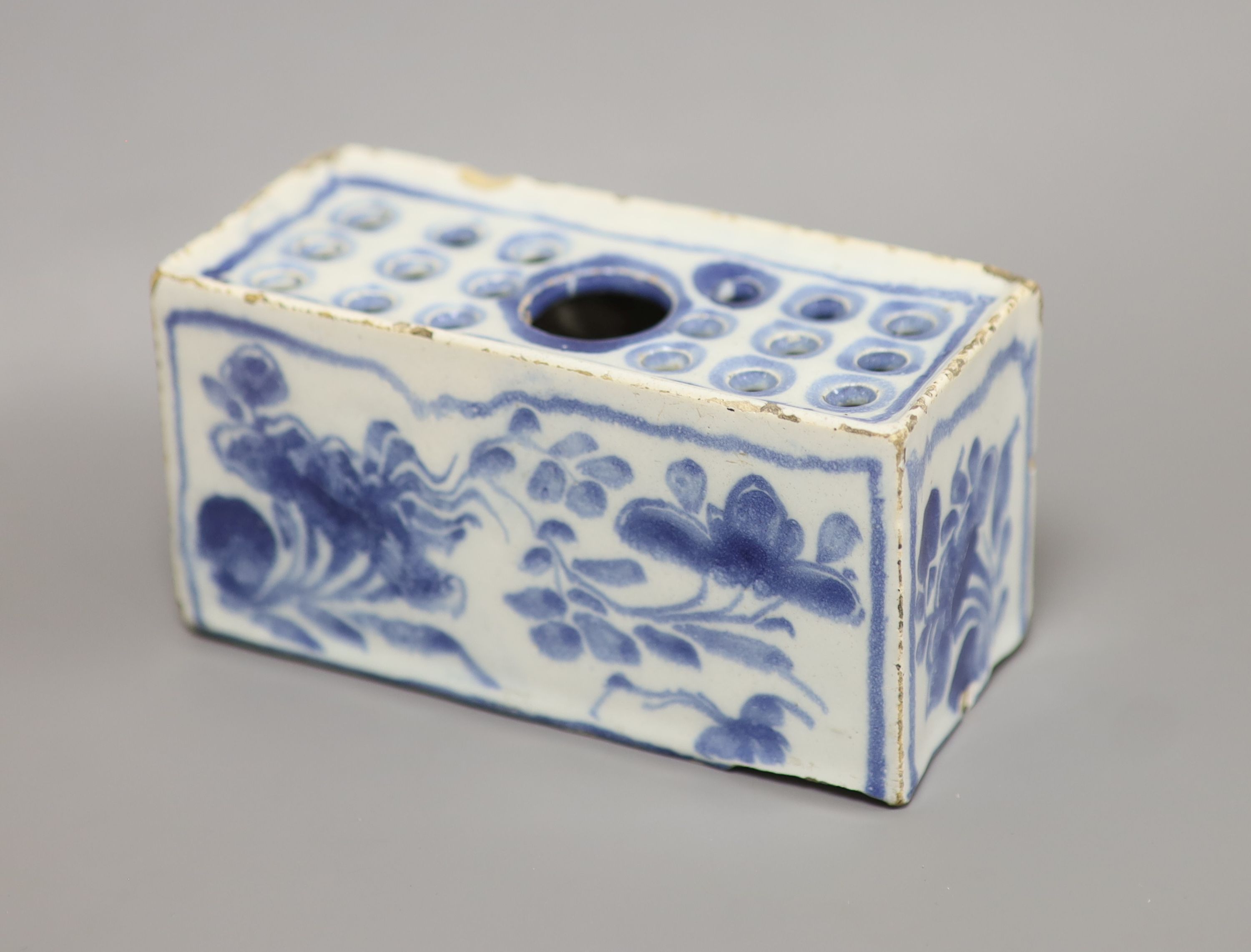 An 18th century Delft ware flower brick, length 12.5cm